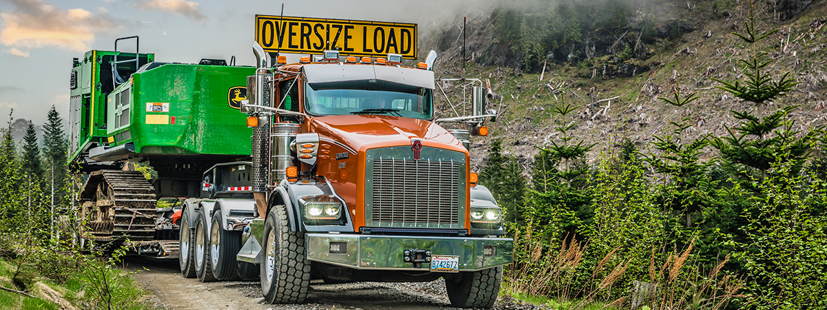 T800 towing a heavy duty machinery