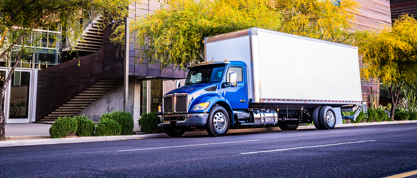 Kenworth T180 truck with van body.