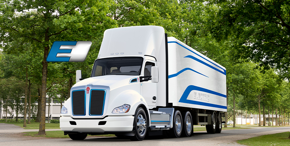 Kenworth T680 electric parked between trees