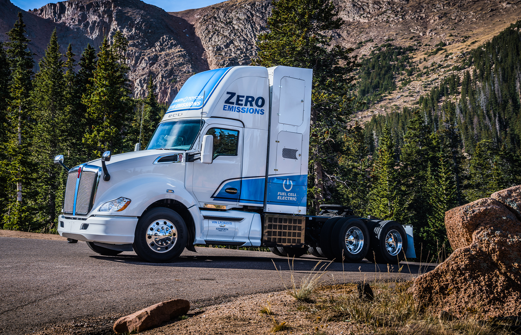 Kenworth T680 electric parked in front of mountain